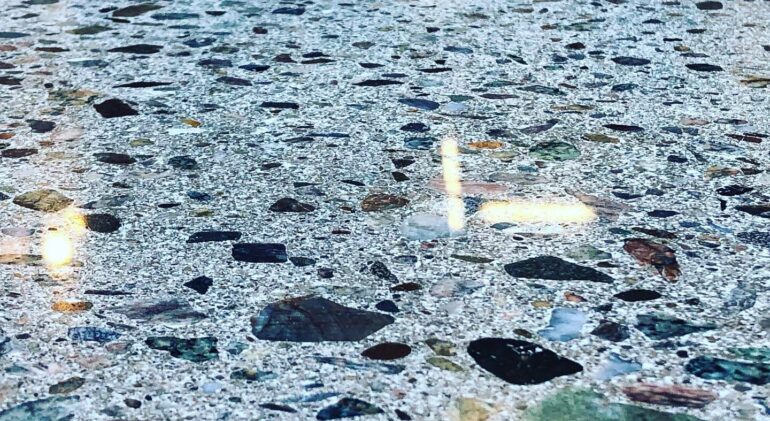 Crushed stone and recycled glass can be included in the design of polished concrete.