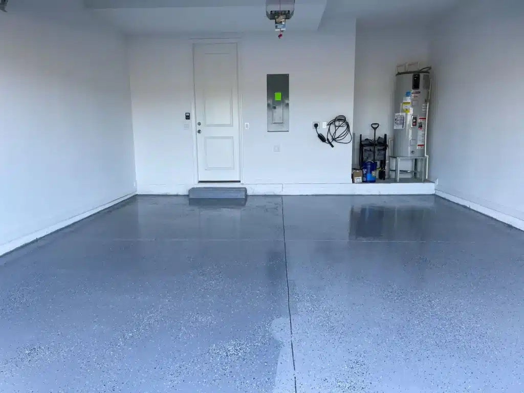 Decorative flake epoxy flooring gives a garage floor a polished finish.
