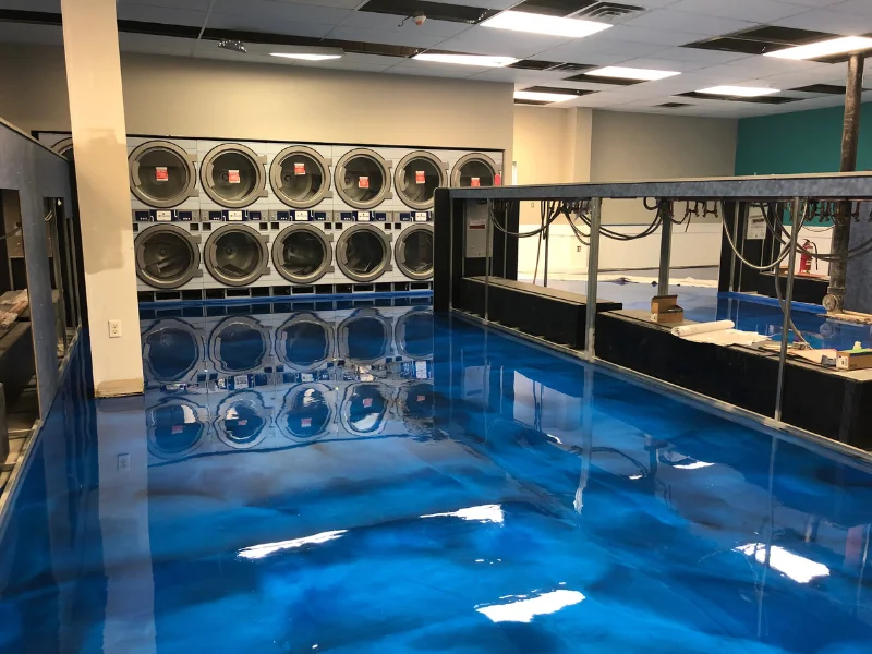 Glossy blue metallic epoxy floor in a laundromat, Brockton, MA