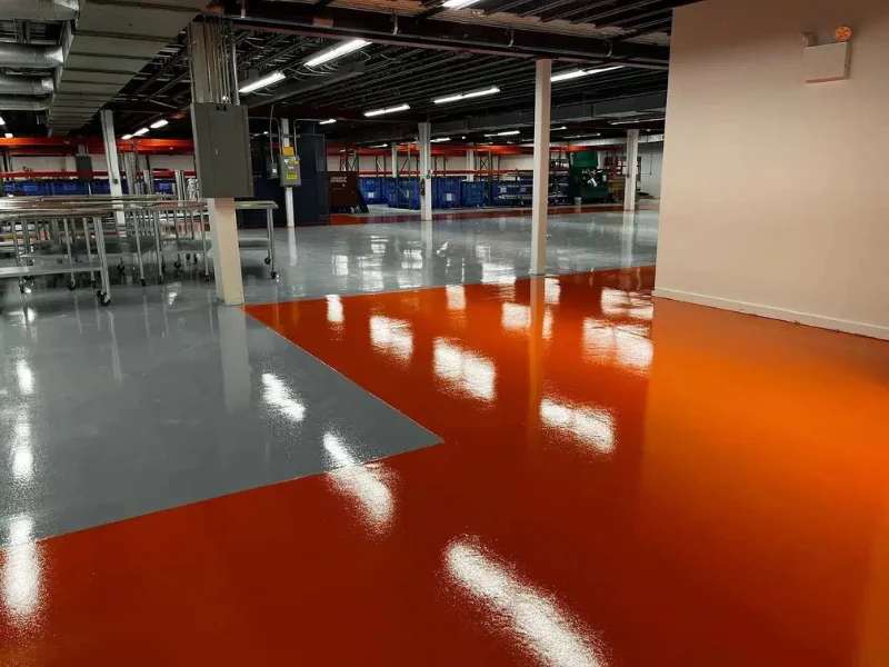 Glossy orange and gray epoxy floor in the High-Purity New England facility, Smithfield, RI