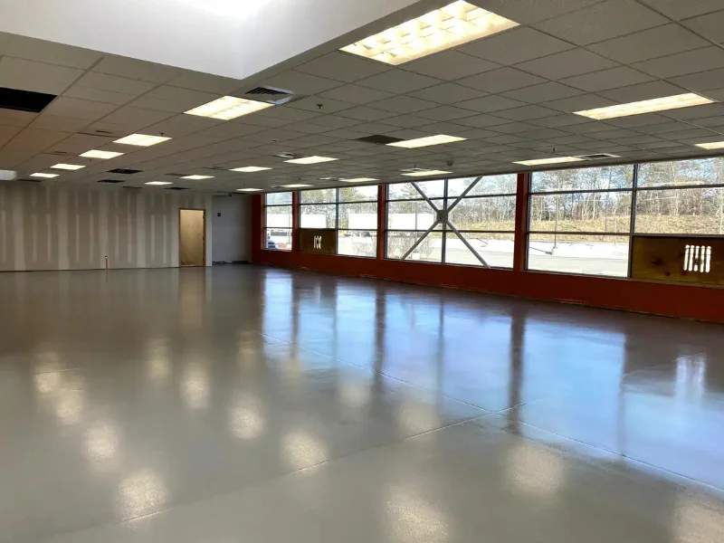 Glossy gray epoxy floor in an open room at Teledyne Marine, Falmouth, MA