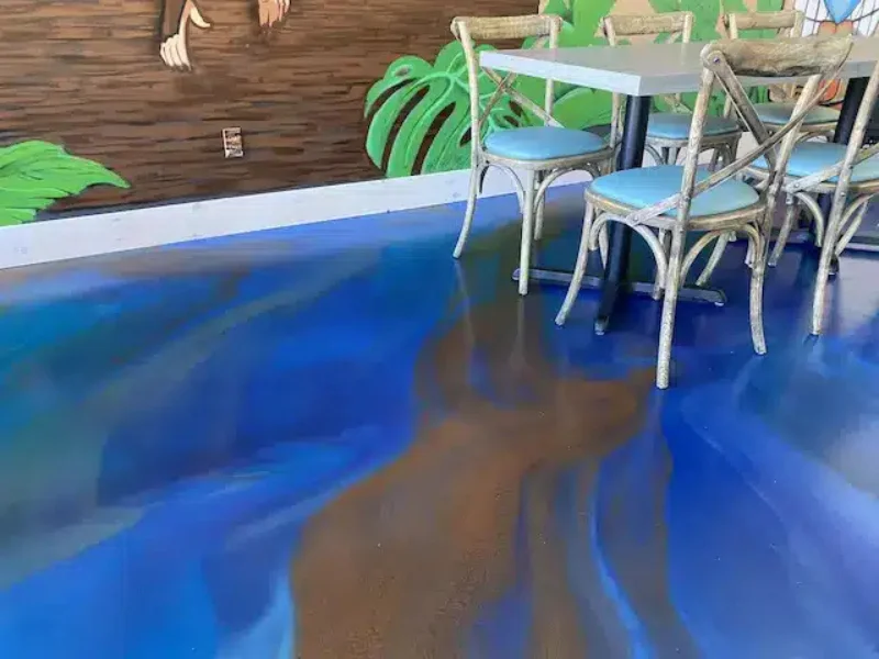 Blue and bronze metallic epoxy floor in a restaurant dining room, Harwich, MA