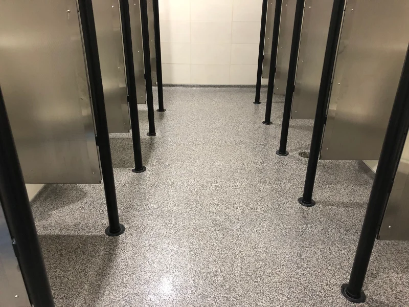 Gray flake epoxy floor in a locker room bathroom, Wareham, MA