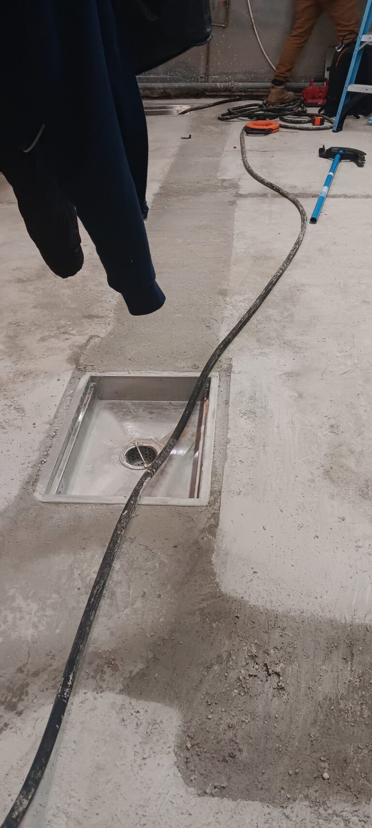 Patching around a floor drain and trench during preparation, Brazilian Grill, Hyannis, MA
