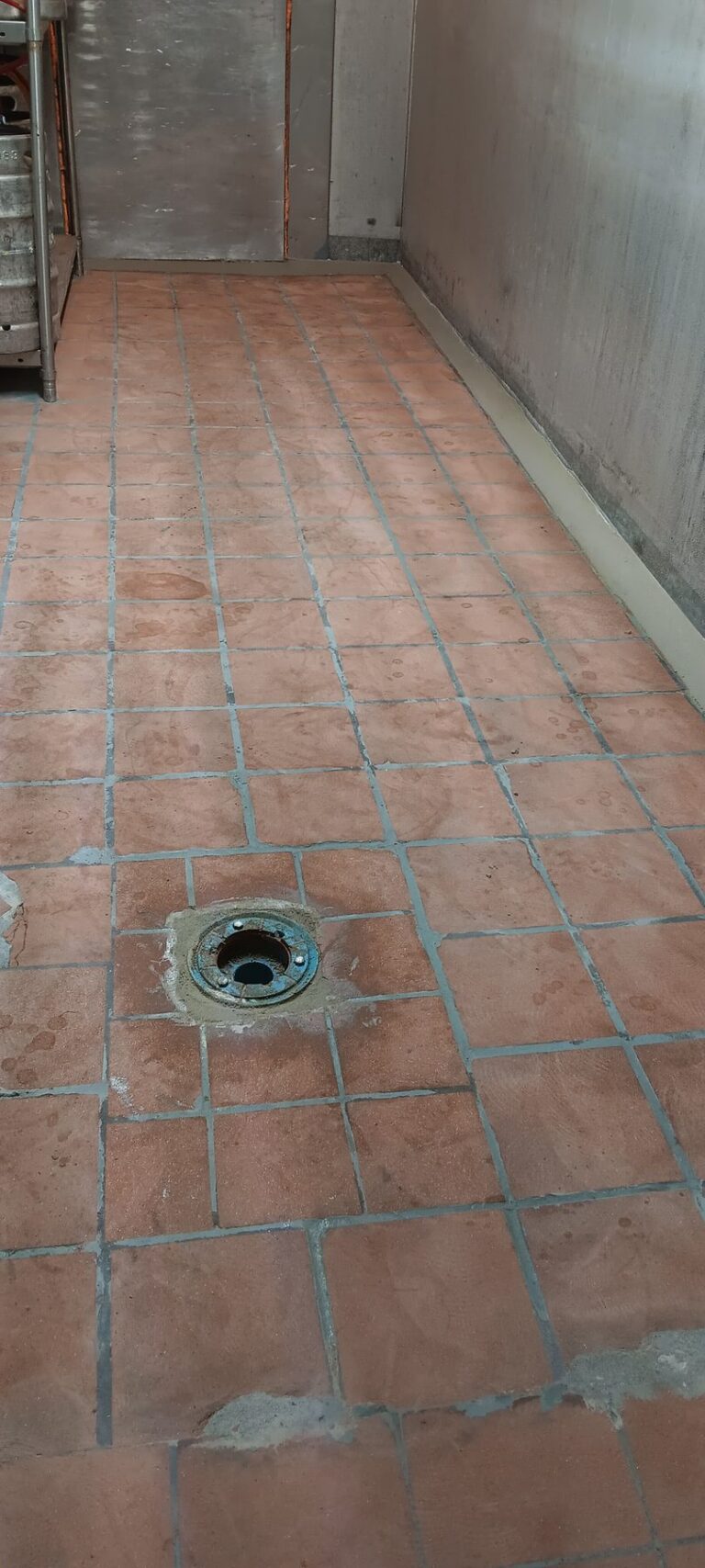 Moisture-mitigation membrane with fiberglass reinforcement around a floor drain, Brazilian Grill, Hyannis, MA