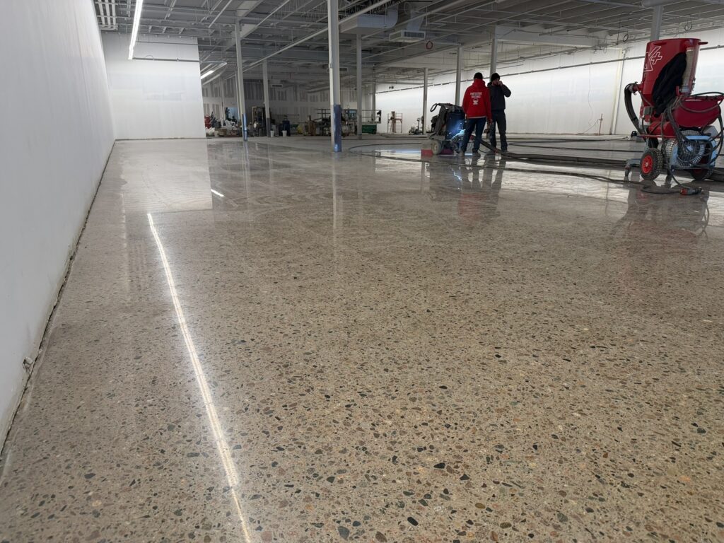Burlington, Walpole, MA: completed polished floor with crew and equipment