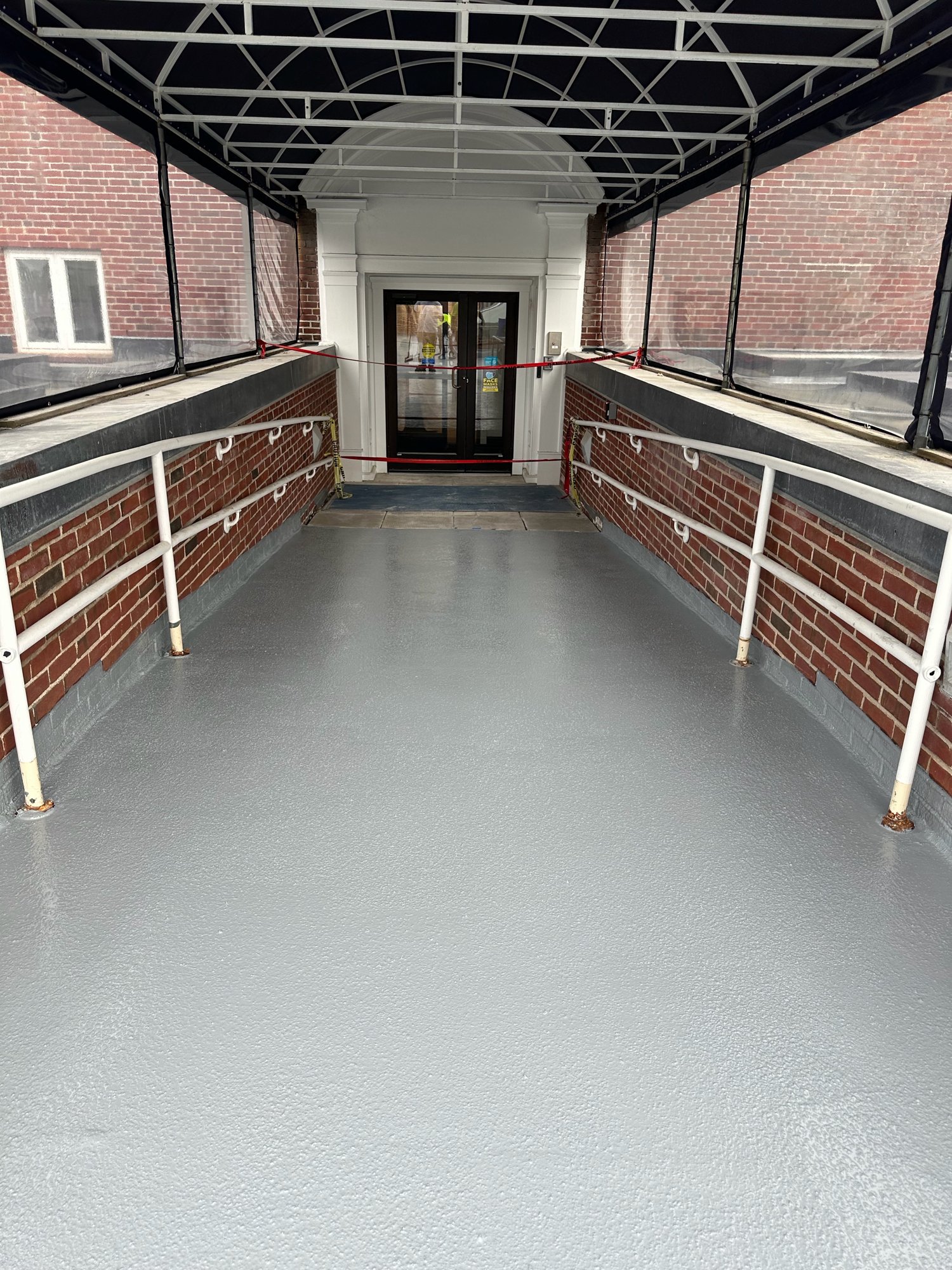 Cape Cod Hospital Parking Deck Case Study 8 Finished gray waterproofing on the covered entrance ramp at Cape Cod Hospital