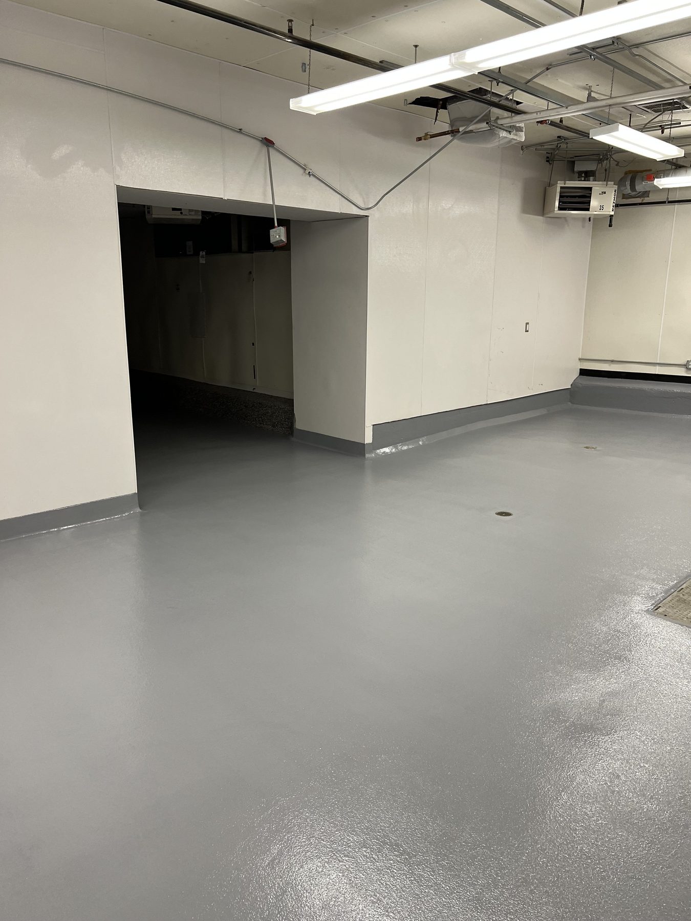 Completed urethane cement kitchen floor with gray cove at the walls, Commonwealth Kitchen, Dorchester, Boston, MA
