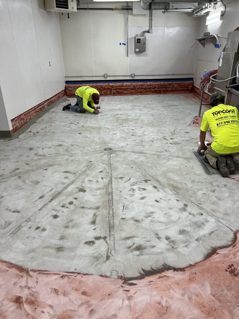 Topcoat crew filling sections between screeds at Commonwealth Kitchen, Dorchester, MA