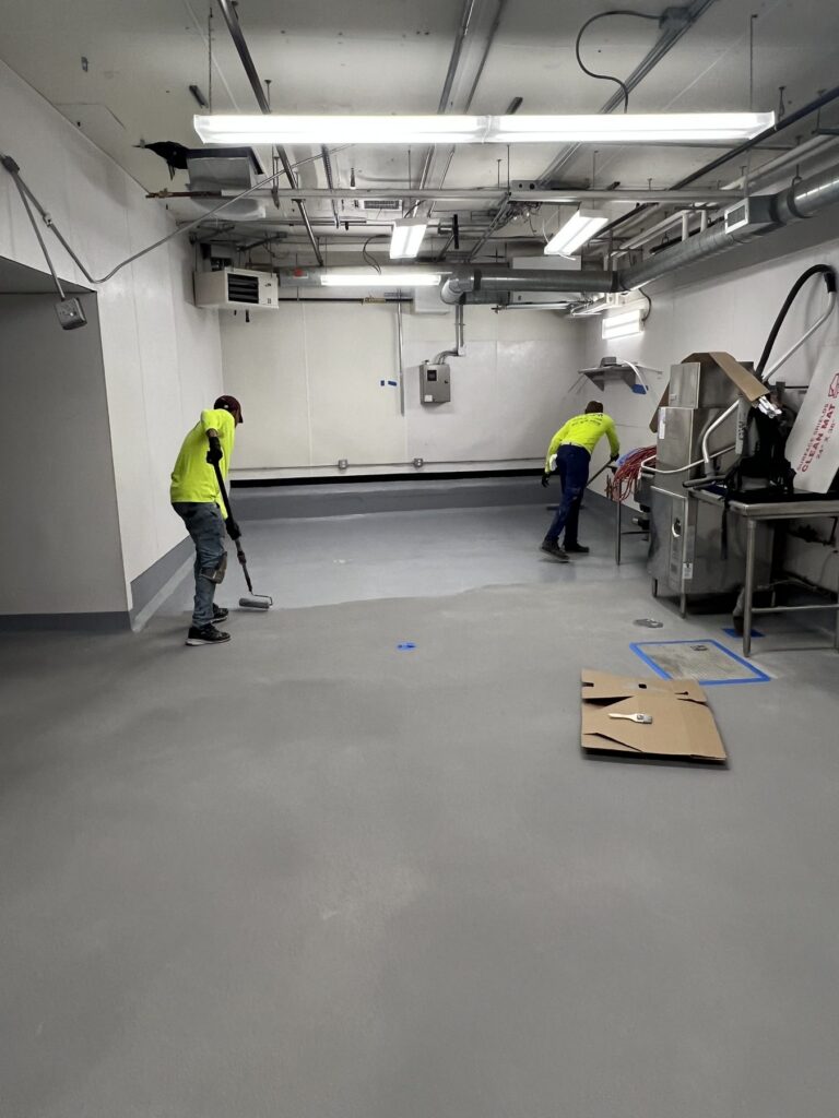 Topcoat crew installing the kitchen floor at Commonwealth Kitchen, Dorchester, MA
