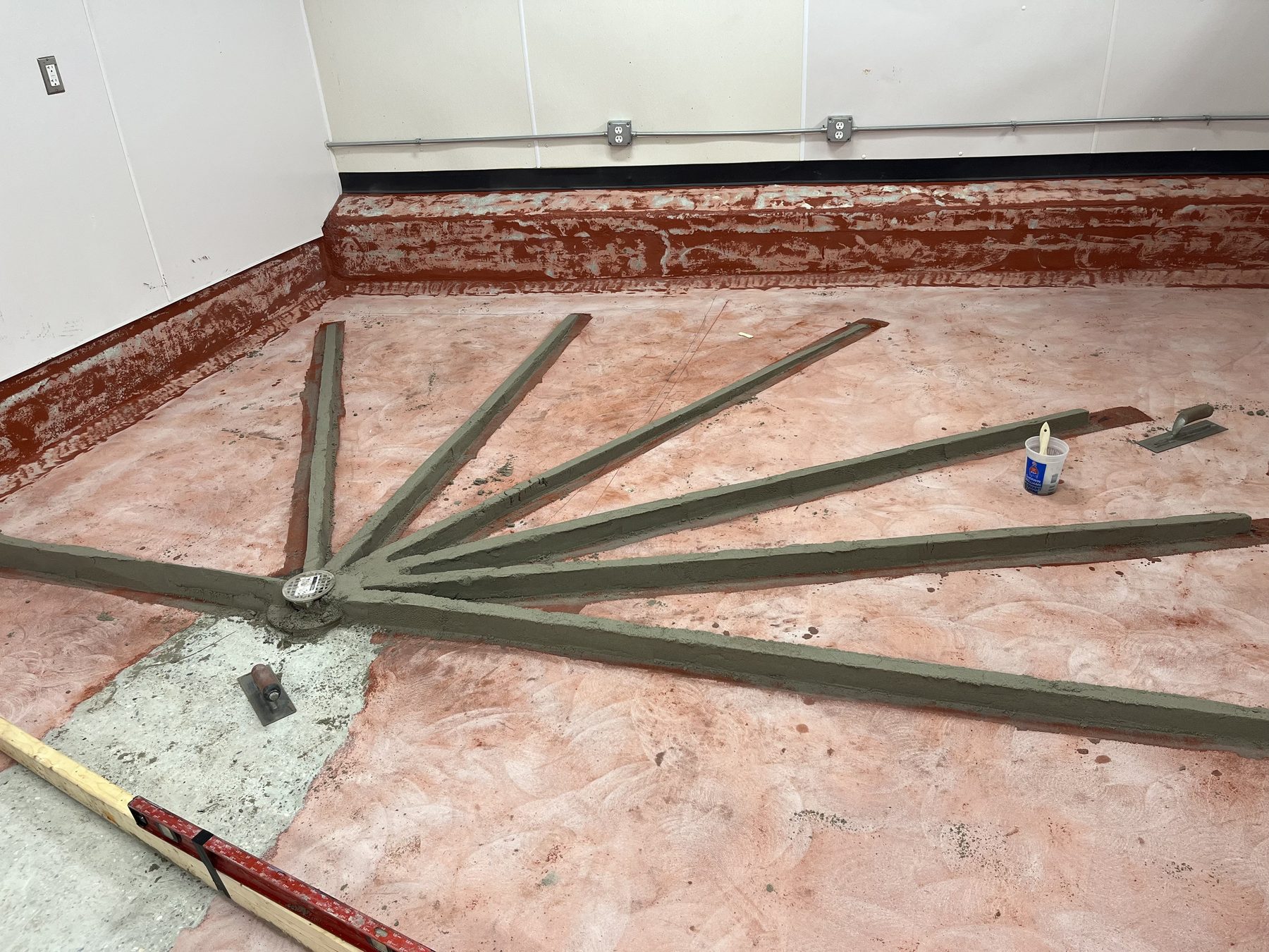Screed strips laid out to set the pitch to the drain, Commonwealth Kitchen, Dorchester, Boston, MA