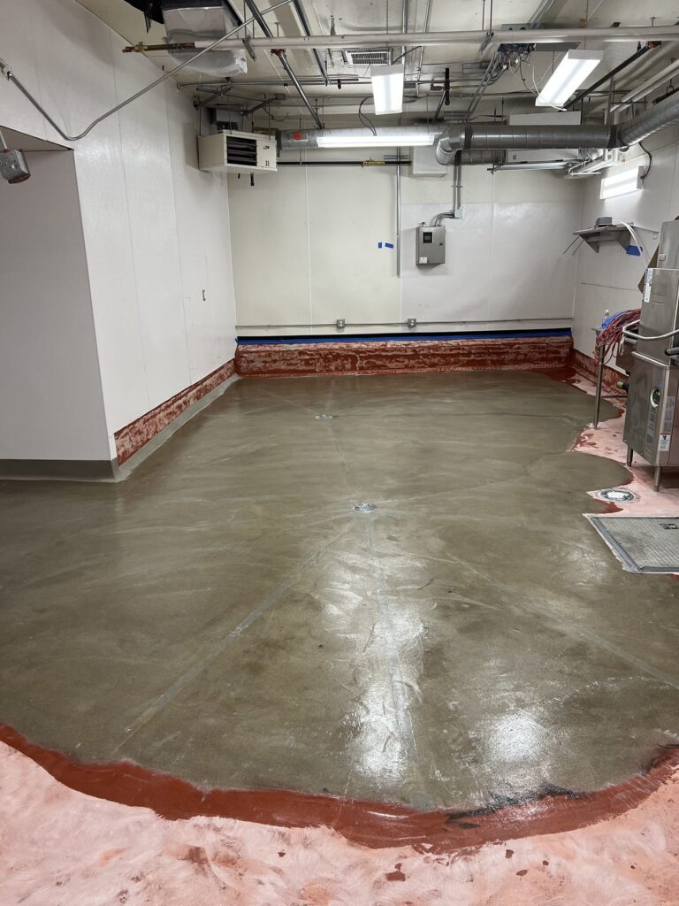 Urethane cement being installed across the kitchen floor at Commonwealth Kitchen, Dorchester, MA