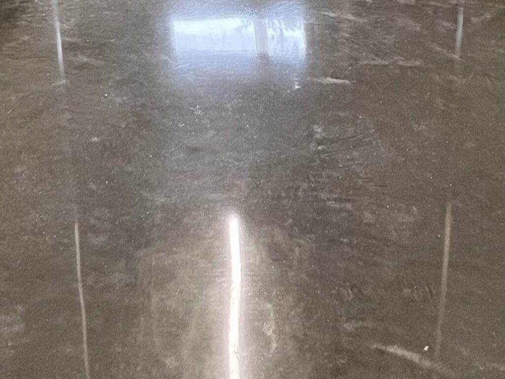 Surface polish concrete floor with light cream and sheen