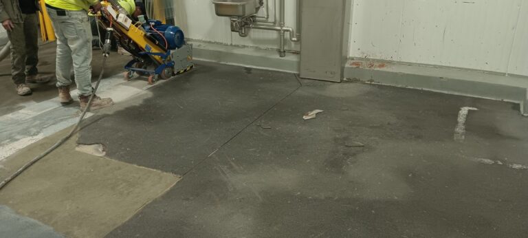 Crew mechanically grinding the existing floor in a food prep room, Joseph’s Gourmet Pasta, Haverhill, MA