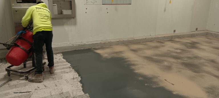 Crew broadcasting Flintshot quartz into the wet basecoat, Joseph’s Gourmet Pasta, Haverhill, MA