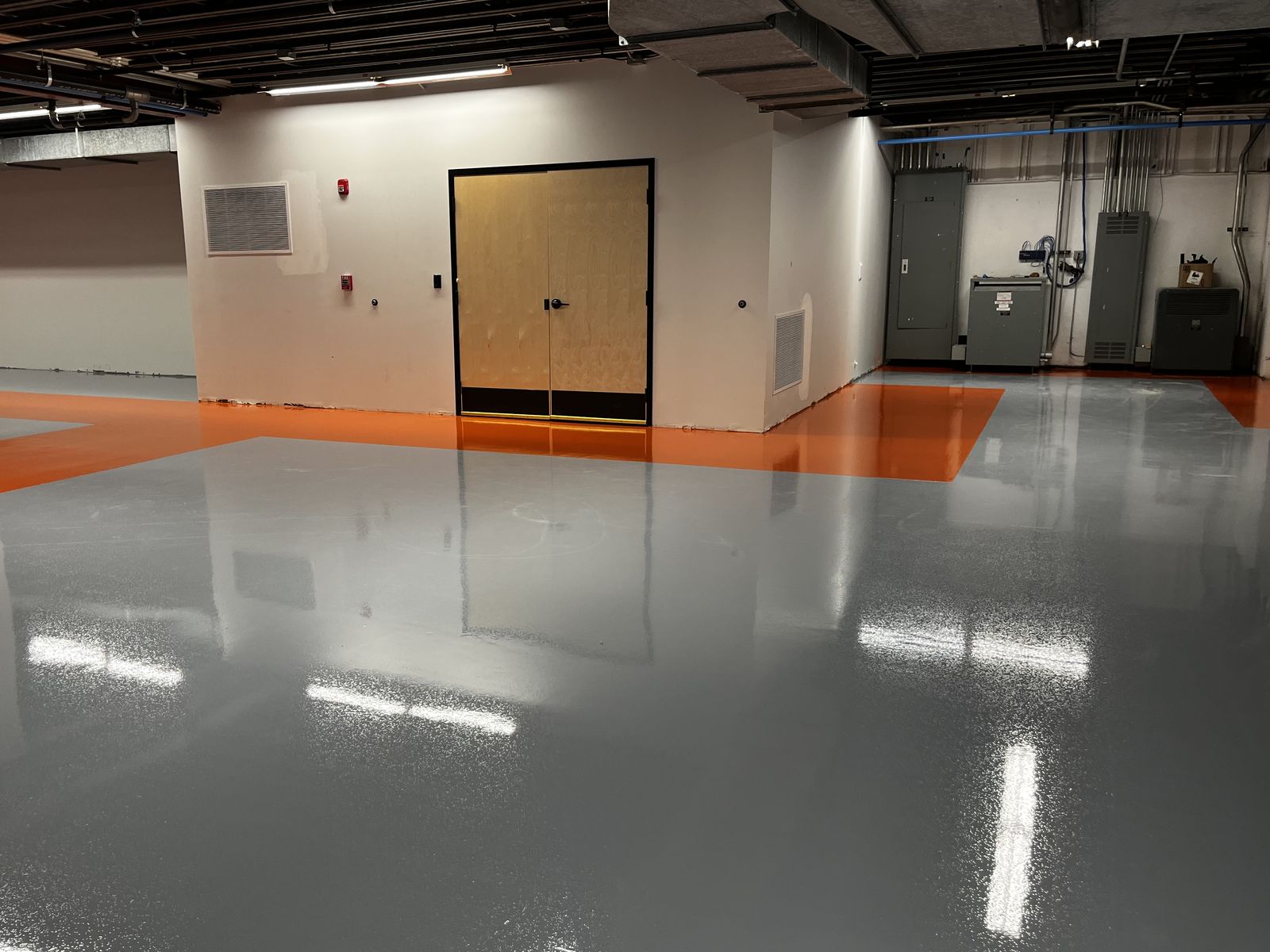Gray floor with orange borders leading to double doors, High Purity New England, Smithfield, RI