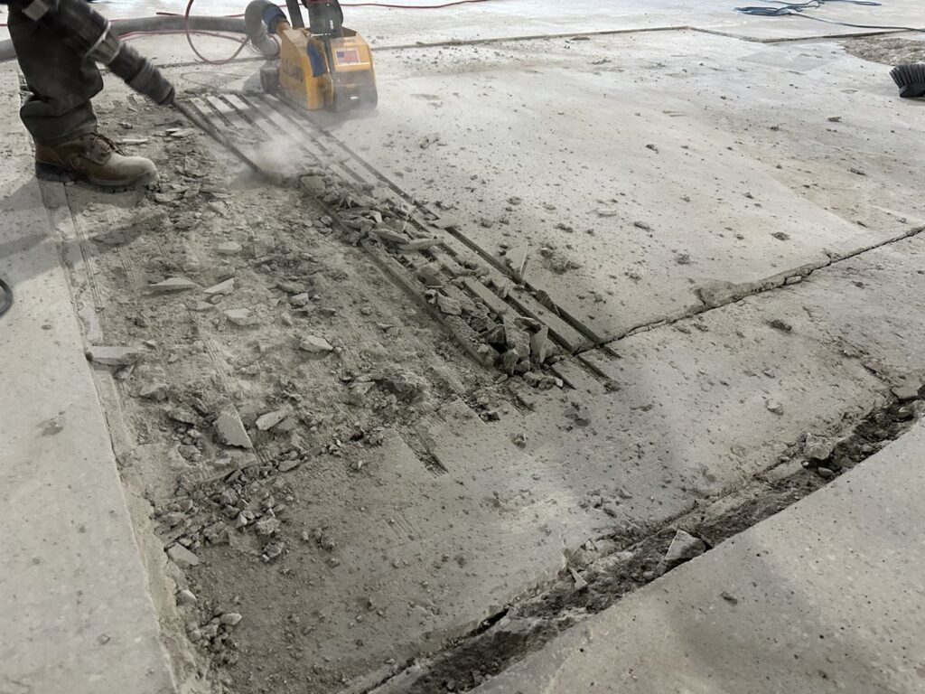 Cut-out section of slab with broken concrete at L.L. Bean Outlet, Framingham
