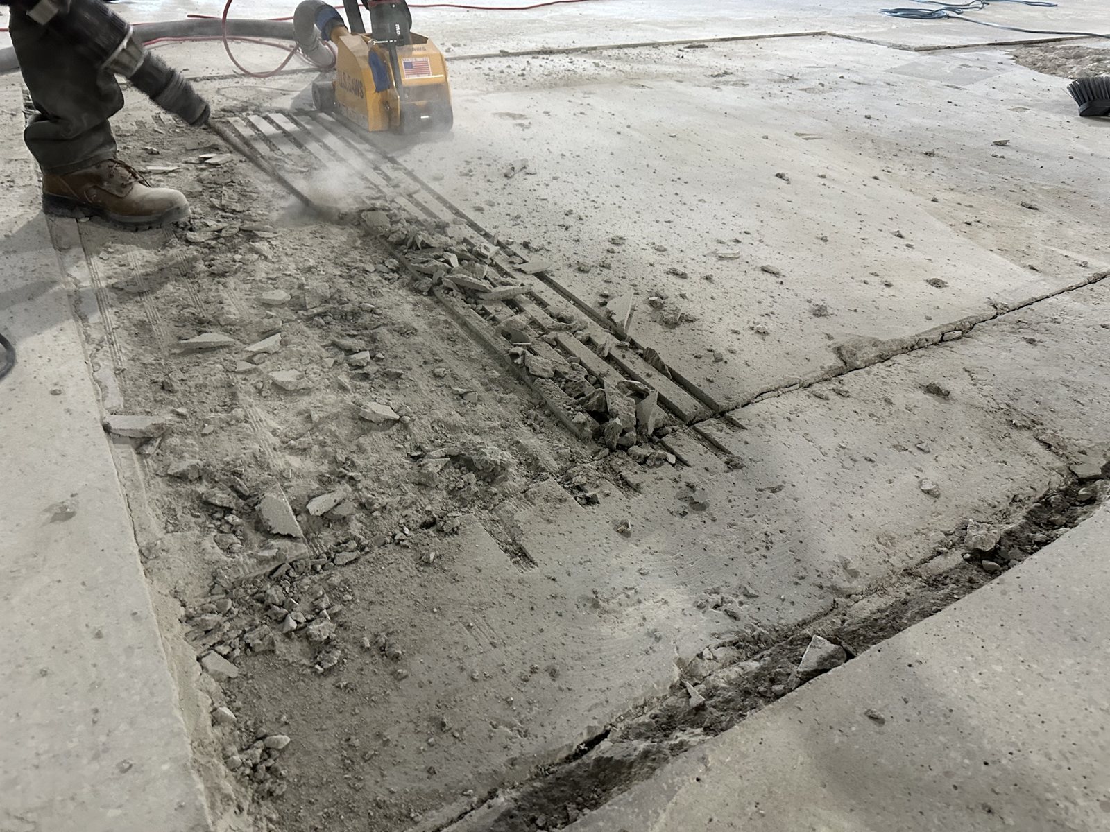 Cut-out section of slab with broken concrete at L.L. Bean Outlet, Framingham