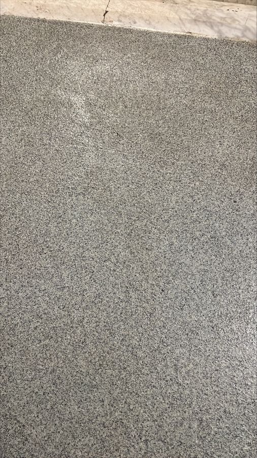 Flooring for Schools & Universities 2 Close-up of a gray and black decorative quartz floor surface, Riverview School, East Sandwich, MA