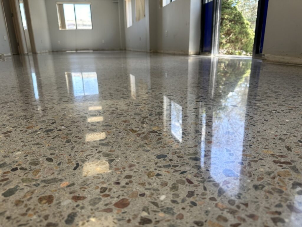 High gloss sheen polished concrete floor with sharp mirror-like reflections