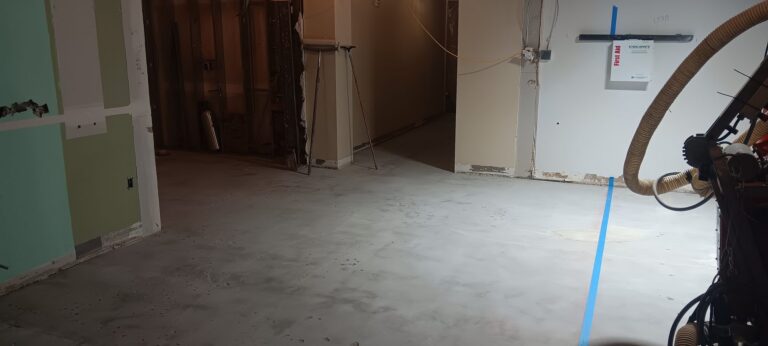 Corridor slab after mechanical preparation, before the overlay, FIXT Lab, Wellesley, MA