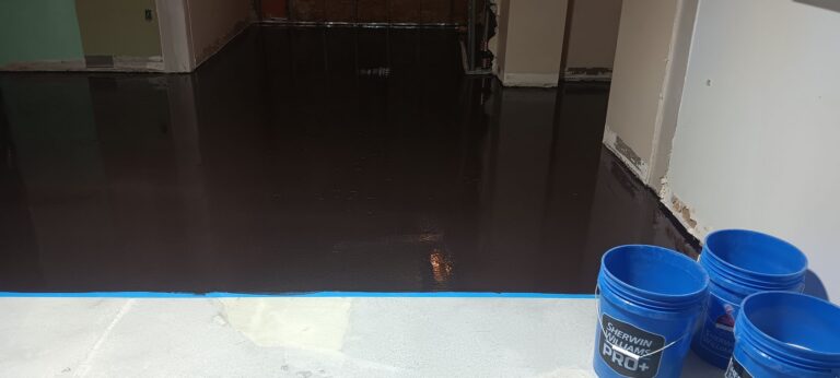 Primed slab with a dark glossy surface before topping placement, FIXT Lab, Wellesley, MA