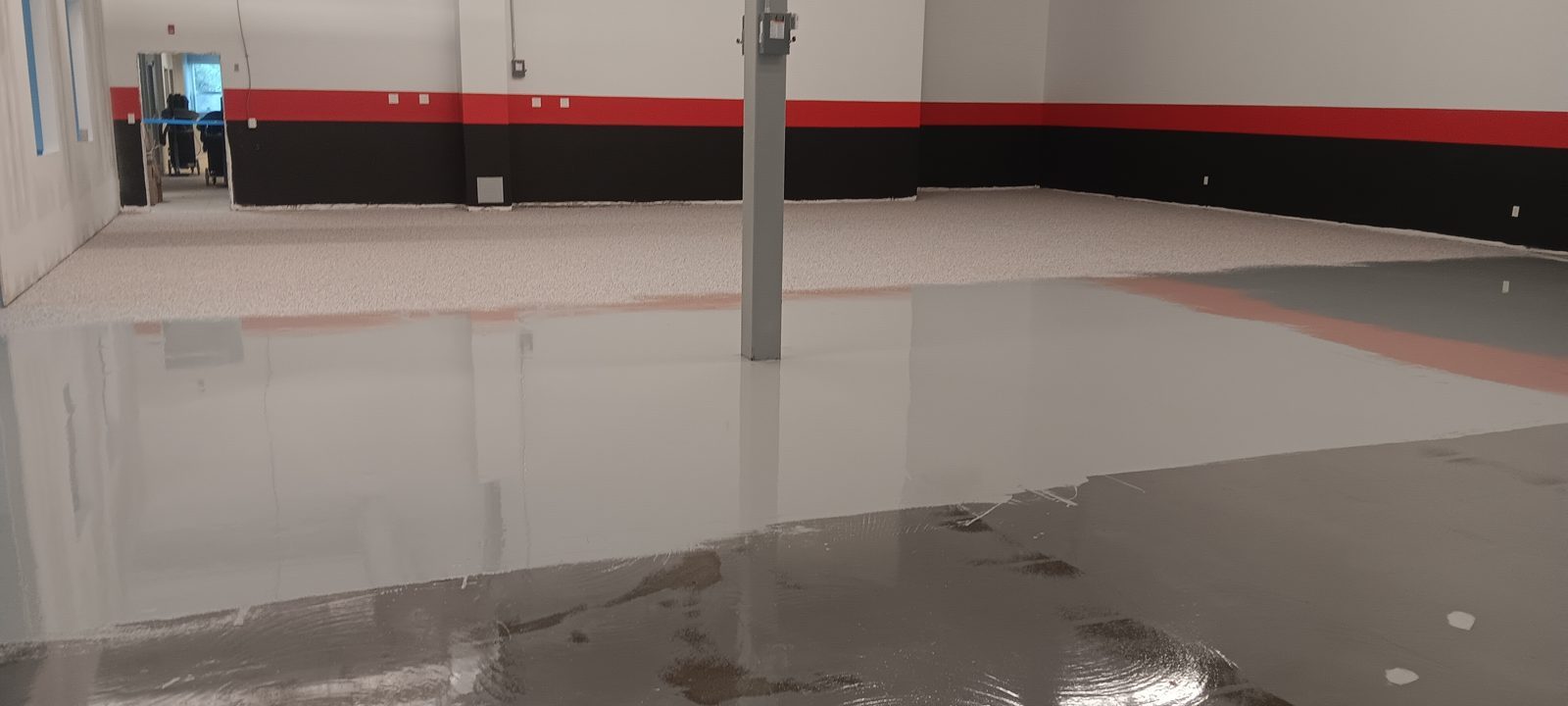 Commercial & Industrial Flooring in Westford 3 Freshly applied resinous coat across the open floor, Telsonic, Westford, MA