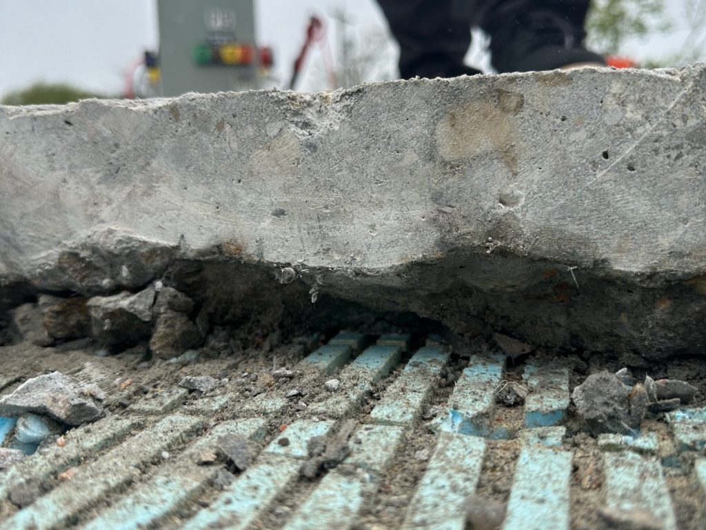 Concrete removed down to the metal decking during repairs on the Cape Cod Hospital parking deck